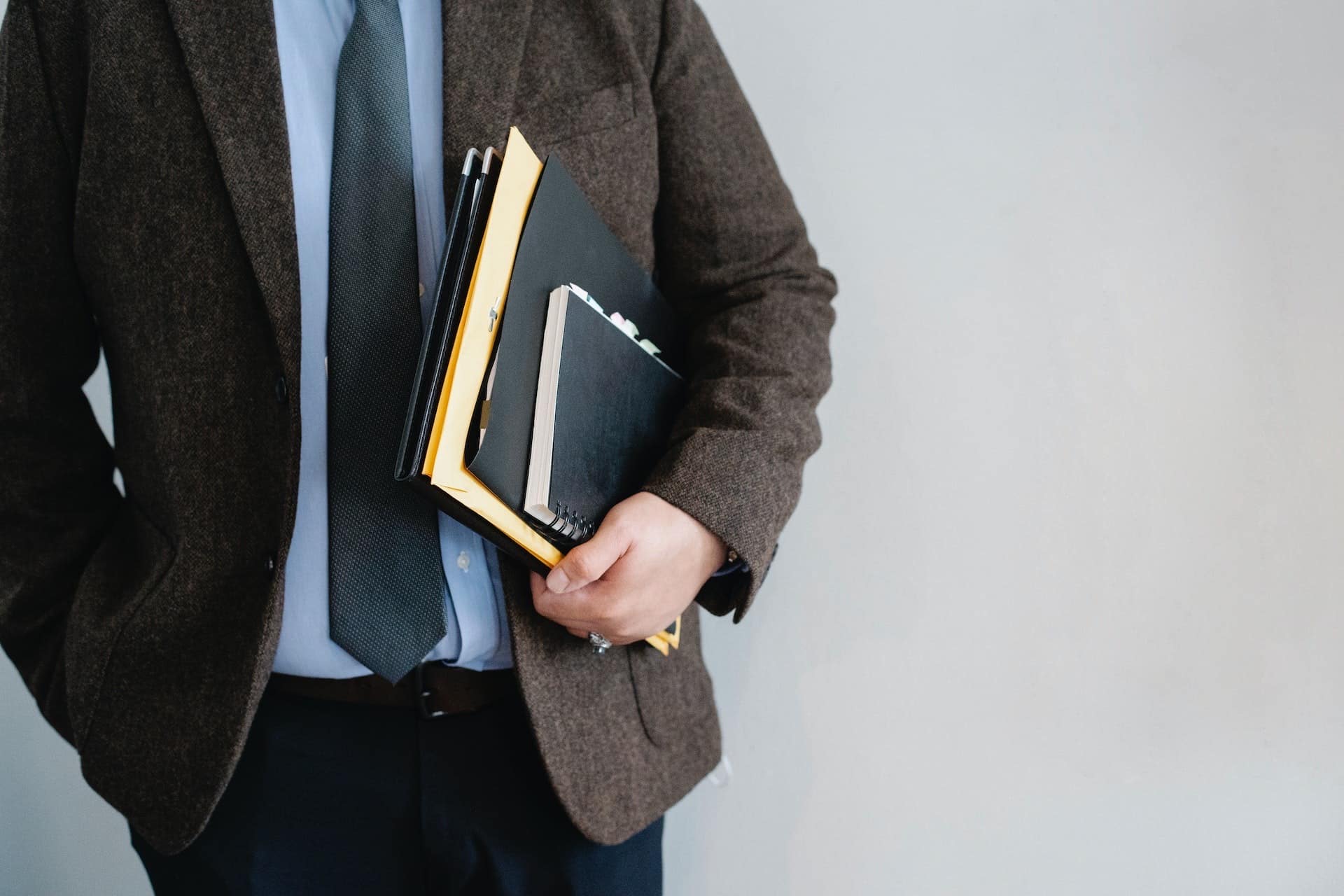 man holding books