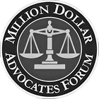 A circular black-and-white logo with a balanced scale in the center and the words Million Dollar Advocates Forum around the edge.