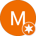An orange circle with a large white letter M in the center. In the lower right, a smaller white circle contains an orange star.