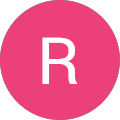 A pink circle with a white, uppercase letter R centered inside. The background is light gray.