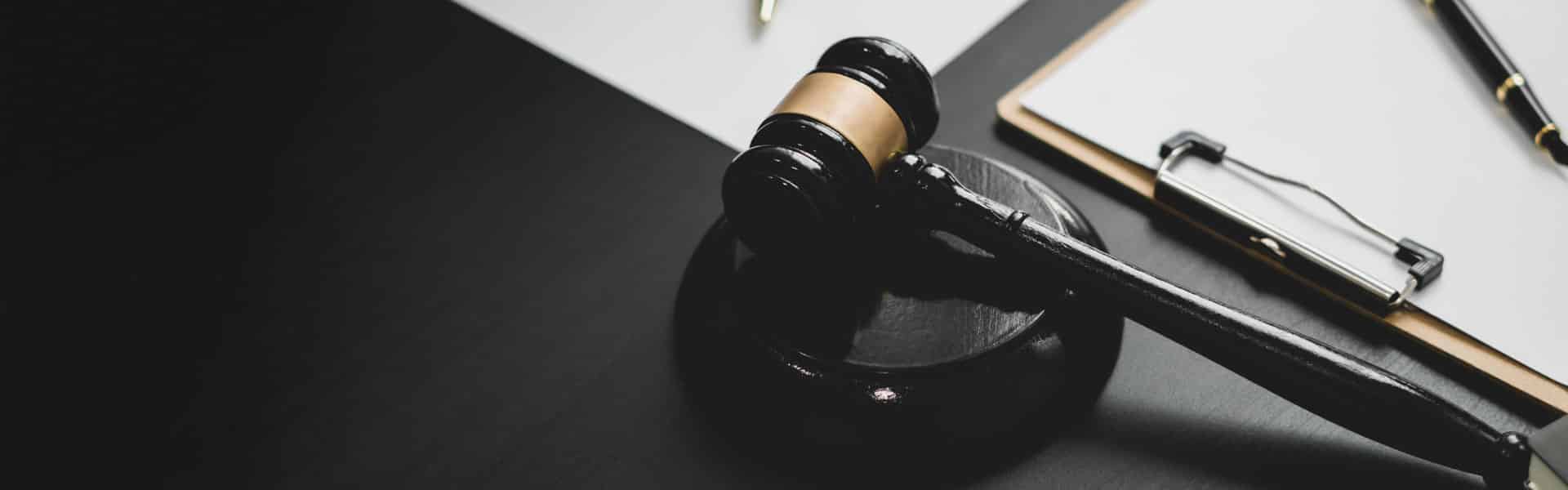 A gavel on a black and white surface.